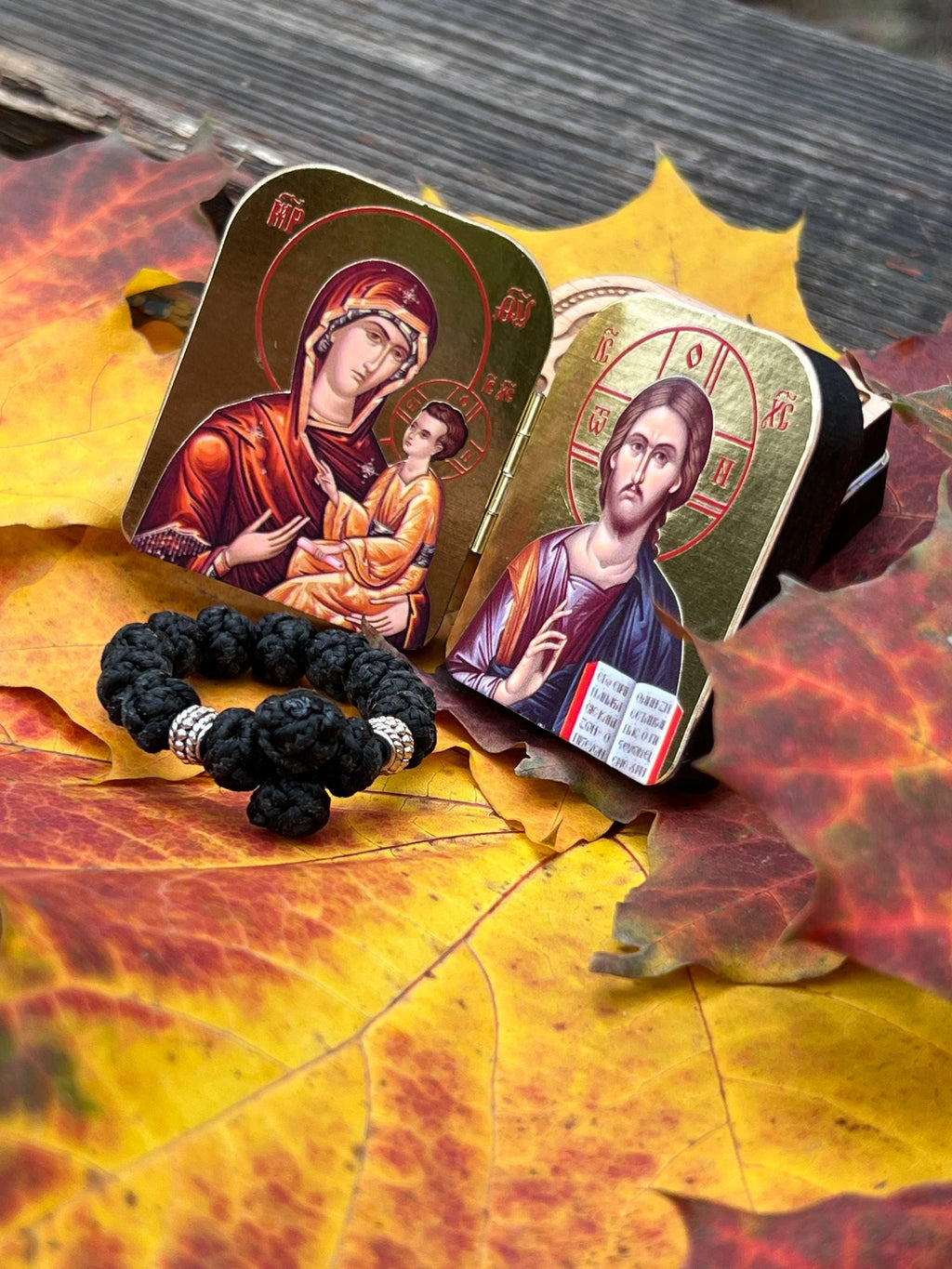 A set of two folding icons 2x1.6 in and a finger rosary. An icon of Jesus Christ and the Mother of God.