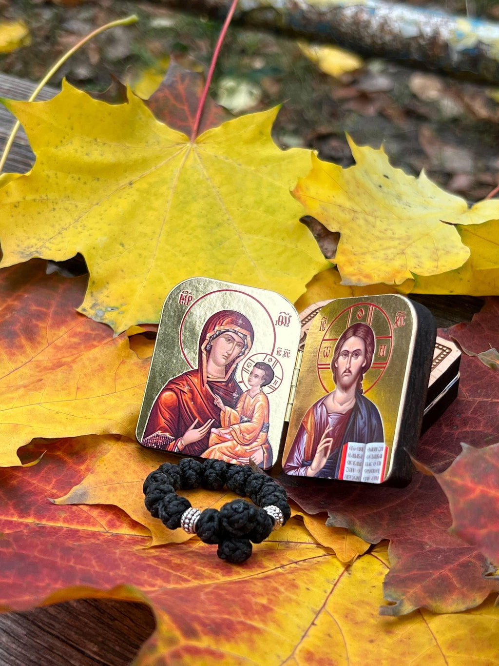 A set of two folding icons 2x1.6 in and a finger rosary. An icon of Jesus Christ and the Mother of God.