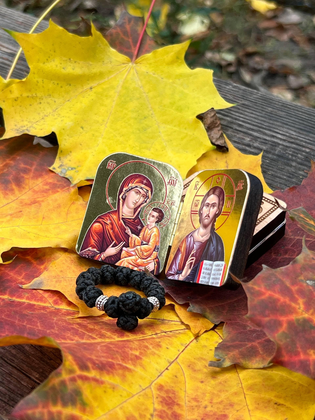 A set of two folding icons 2x1.6 in and a finger rosary. An icon of Jesus Christ and the Mother of God.