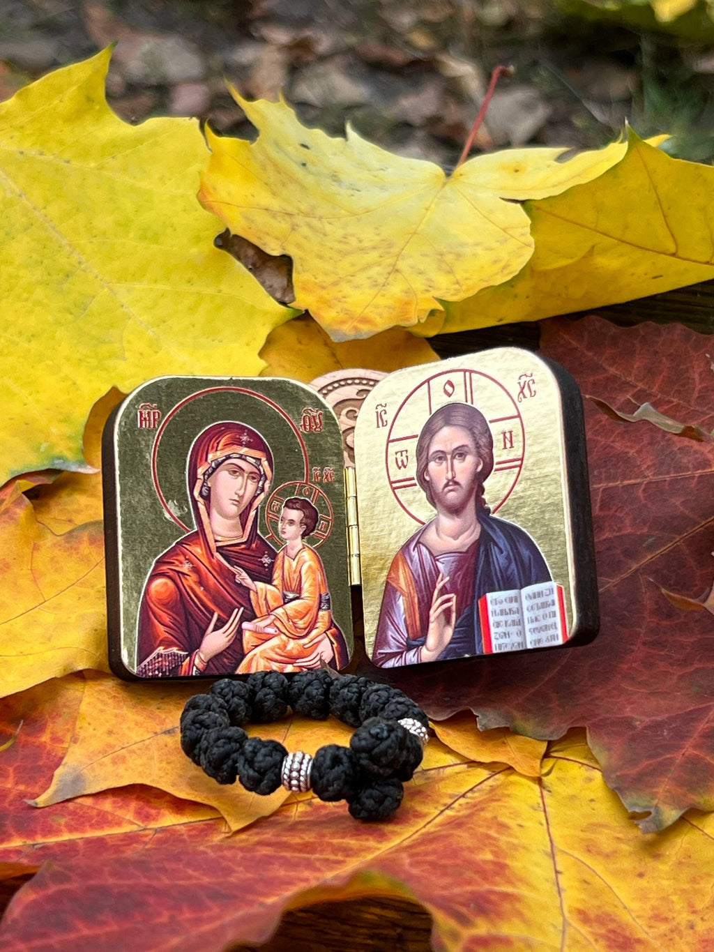 A set of two folding icons 2x1.6 in and a finger rosary. An icon of Jesus Christ and the Mother of God.