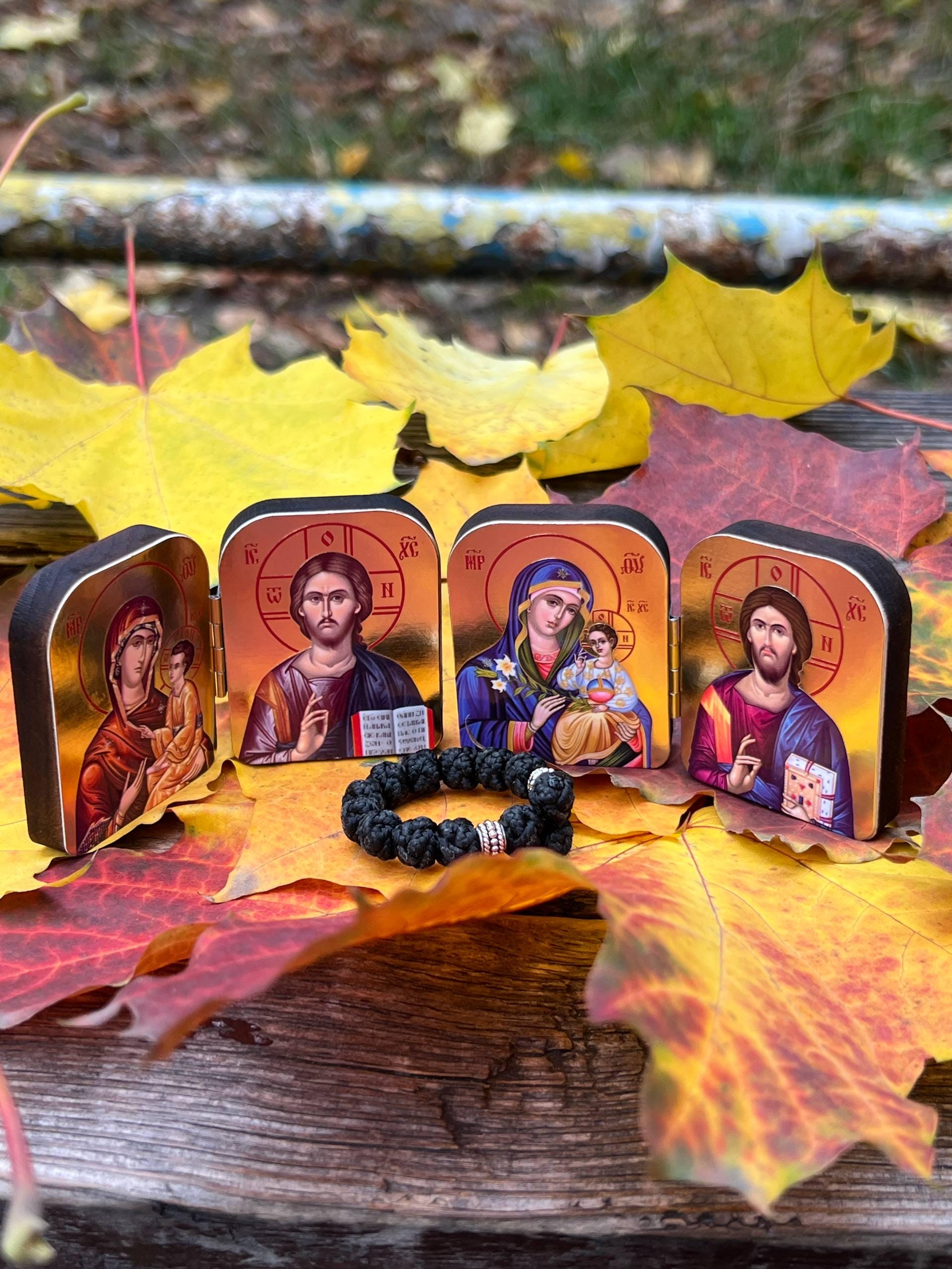 A set of two folding icons 2x1.6 in and a finger rosary. An icon of Jesus Christ and the Mother of God.
